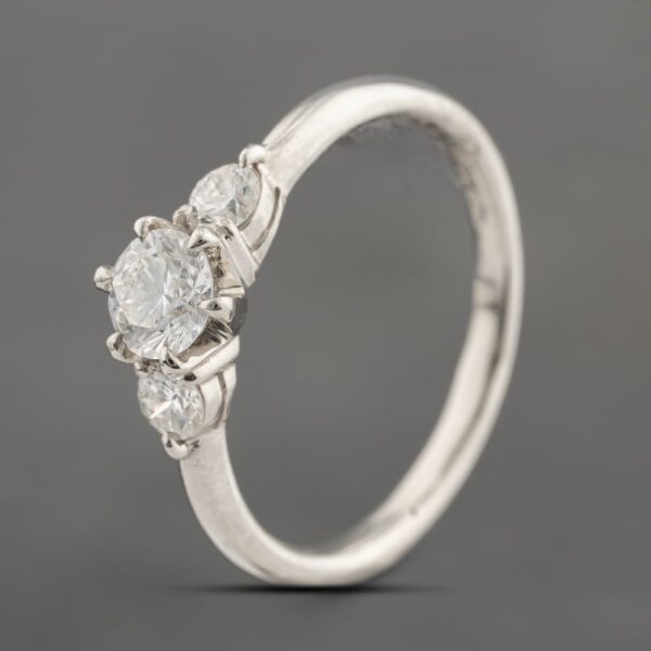 Pre-Owned Platinum 0.64ct Brilliant Cut Diamond Three Stone Ring 43121282