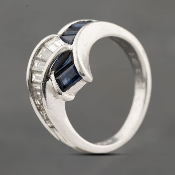 Pre-Owned Platinum 1.42ct Sapphire & 0.91ct Baguette Cut Diamond Cross Over Dress Ring 43361180