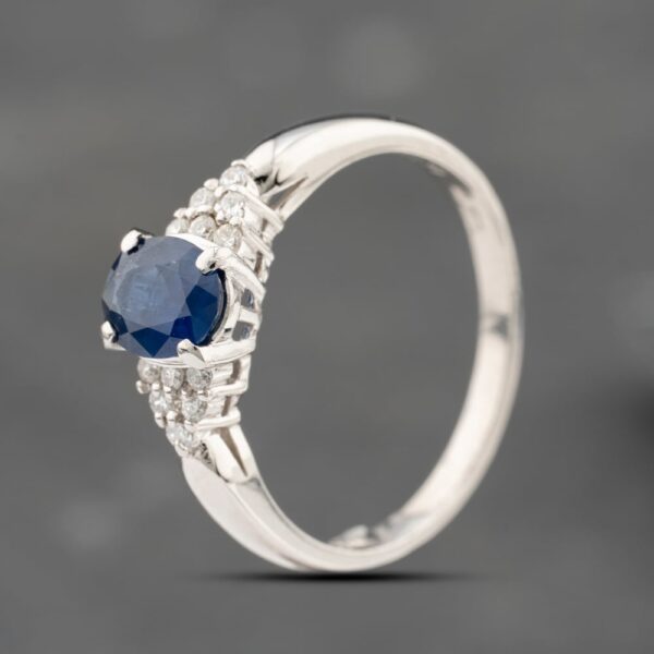 Pre-Owned Platinum 0.79ct Sapphire & 0.10ct Brilliant Cut Diamond Oval Cluster Ring 43361208