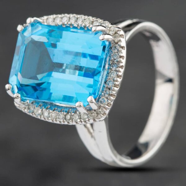 Pre-Owned 14ct White Gold 9.44ct Blue Topaz & 0.27ct Brilliant Cut Diamond Oblong Cluster Ring 4345017