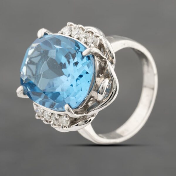 Pre-Owned Platinum 12.43ct Blue Topaz & 0.21ct Brilliant Cut Diamond Oval Dress Ring 43451016